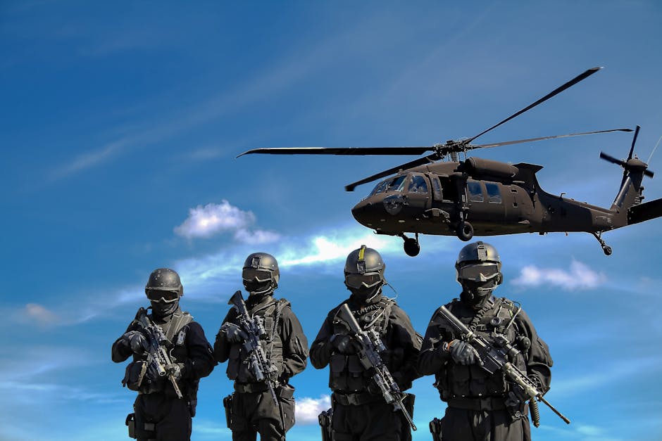 Special forces soldiers in tactical gear with helicopter overhead under a blue sky.